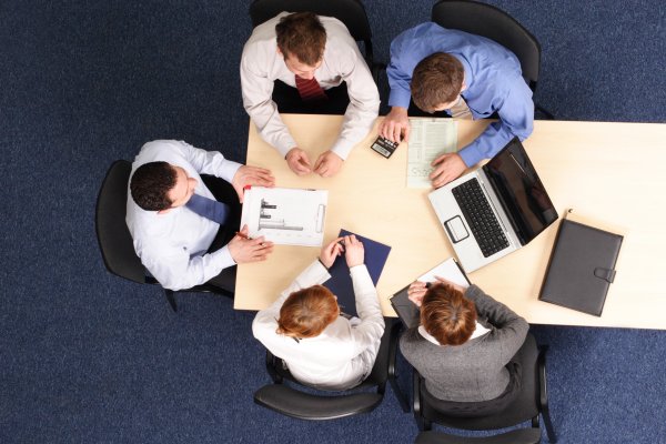 Top view of businessmen in a meeting in an office